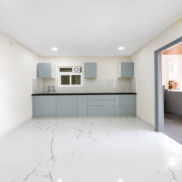 Modern kitchen, luxury kitchen, premium kitchen interior, modular kitchen, contemporary kitchen, elegant kitchen design, stylish kitchen, modern home interior, luxury home, premium living space, designer kitchen, L-shaped kitchen, white kitchen cabinets, glossy cabinets, black countertop, granite countertop, kitchen backsplash, modern chimney, built-in kitchen, kitchen storage, overhead cabinets, lower cabinets, modular cabinetry, kitchen sink, black kitchen sink, gas stove, kitchen appliances, LED lighting, under-cabinet lighting, ceiling lights, ceiling fan, marble flooring, white flooring, neutral interior, minimalist kitchen, sophisticated interior, contemporary home decor, luxury apartment, residential interior, modern architecture, stylish home decor, indoor plants, decorative accessories, dining area, utility area, kitchen organization, clean kitchen, spacious kitchen, high-end interior, aesthetic kitchen, dream home.
 